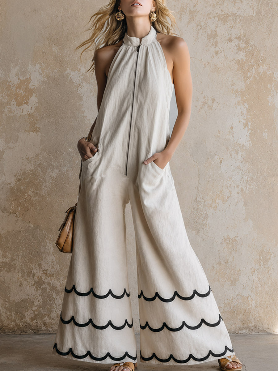 Klassischer Neckholder-Jumpsuit aus cremeweißem Baumwoll-Leinen mit kontrastfarbener Wellenkante