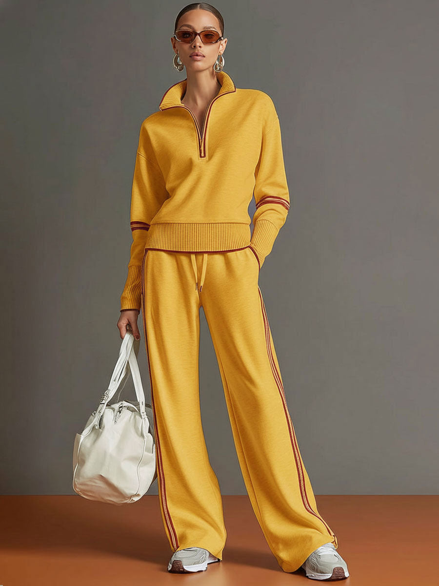 Retro-sportliches Set: Grau-weißes Sweatshirt mit Ripsband und halbem Reißverschluss und weit geschnittene Hose