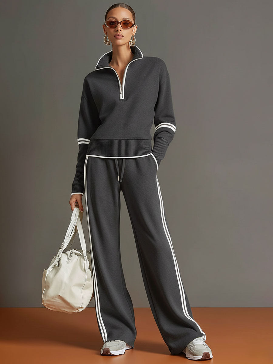 Retro-sportliches Set: Grau-weißes Sweatshirt mit Ripsband und halbem Reißverschluss und weit geschnittene Hose