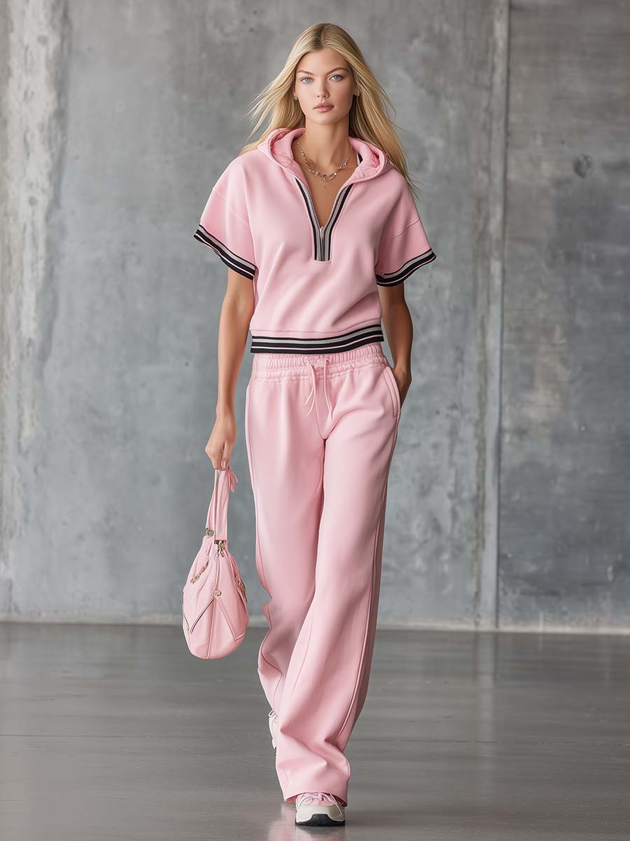 Elegantes sportliches Set: Kurzärmeliges Kapuzentop mit Reißverschluss aus rosa Baumwolle und Hose