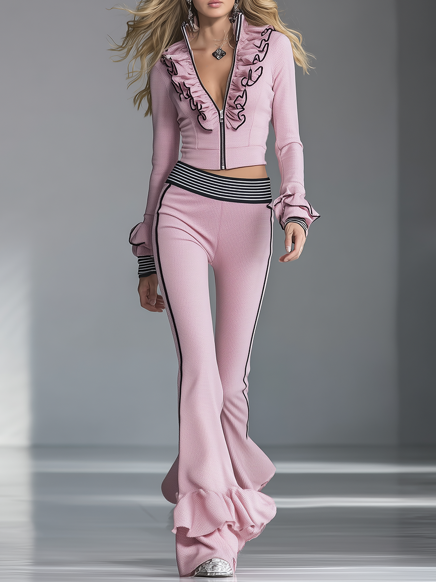Elegantes Sport-Set aus rosa Schlaghose mit schwarzem Besatz
